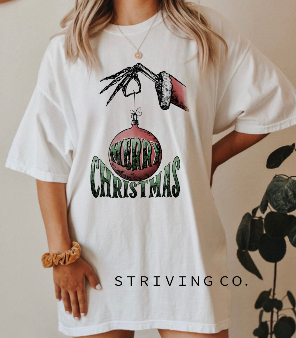 Merry Christmas skull hand + ornament tee